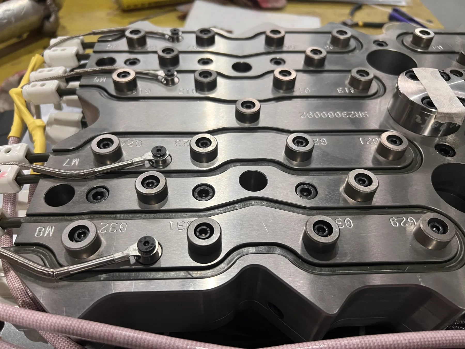 PET preform mold hot-runner hardware close-up